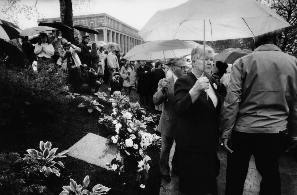 William Schroeder’s parents, Florence and Louis, file past the plaque bearing their son’s name near the new May 4 Memorial at Kent State, May 4, 1990.