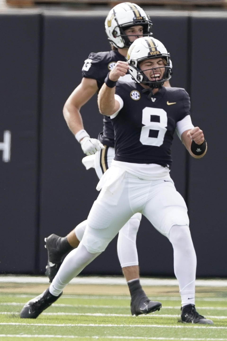 Vanderbilt quarterback Ken Seals (8) celebrates the team's touchdown against Georgia in the first half of an NCAA college football game Saturday, Oct. 14, 2023, in Nashville, Tenn. (AP Photo/George Walker IV)