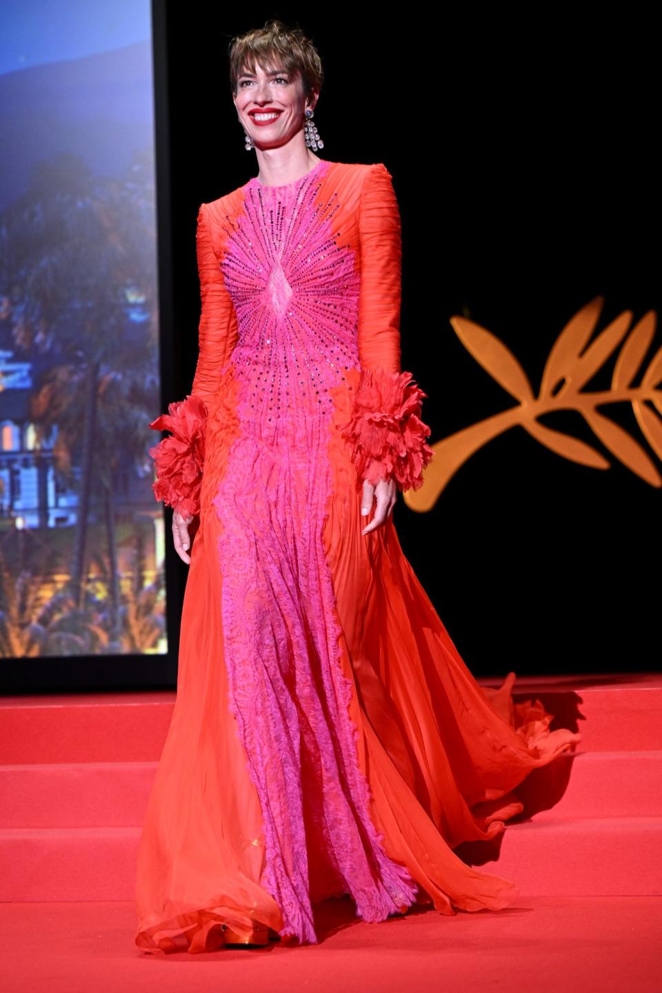 <p>Jury member Rebecca Hall arrives on stage during the opening ceremony for the 75th annual Cannes Film Festival at Palais des Festivals in France on May 17.</p>