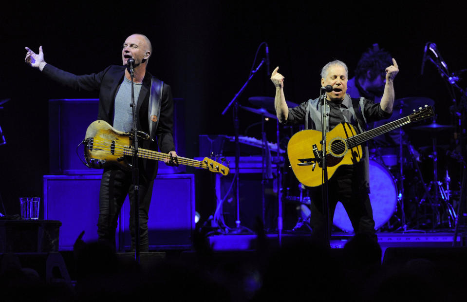 Musicians Sting, left, and Paul Simon perform together in concert at Madison Square Garden on Tuesday, March 4, 2014, in New York. (Photo by Evan Agostini/Invision/AP)