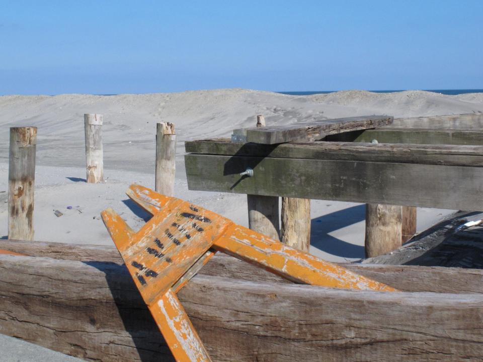In this Feb. 12, 2013 photo, a saw horse sits atop the remnants of Avon, N.J.'s boardwalk, which was destroyed by Superstorm Sandy. Dogged by legal and environmental woes, Avon is lagging behind some other Jersey shore towns in terms of quickly rebuilding storm-damaged boardwalks. (AP Photo/Wayne Parry)