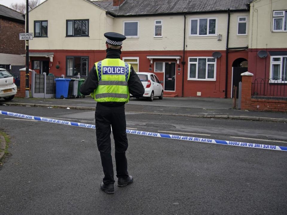 Police at the scene after a 16-year-old boy was fatally stabbed on on Thirlmere Avenue in Stretford, Manchester (PA) (PA Wire)