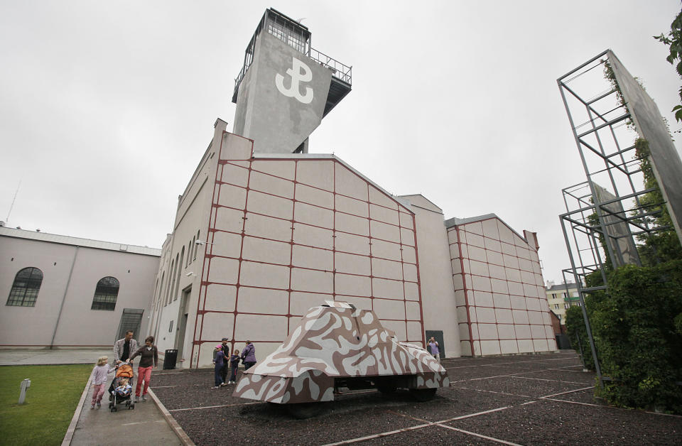 This Aug. 10, 2013 photo shows visitors touring the Warsaw Rising Museum in Warsaw, Poland. The multimedia museum presents films, pictures and dramatic accounts from the fighters of the 1944 uneven and failed struggle against the occupying Nazi German forces. Some 200,000 fighters and residents were killed and the city was razed. The museum is free on Sundays starting Sept. 1 and in August free on Mondays. (AP Photo/Czarek Sokolowski)