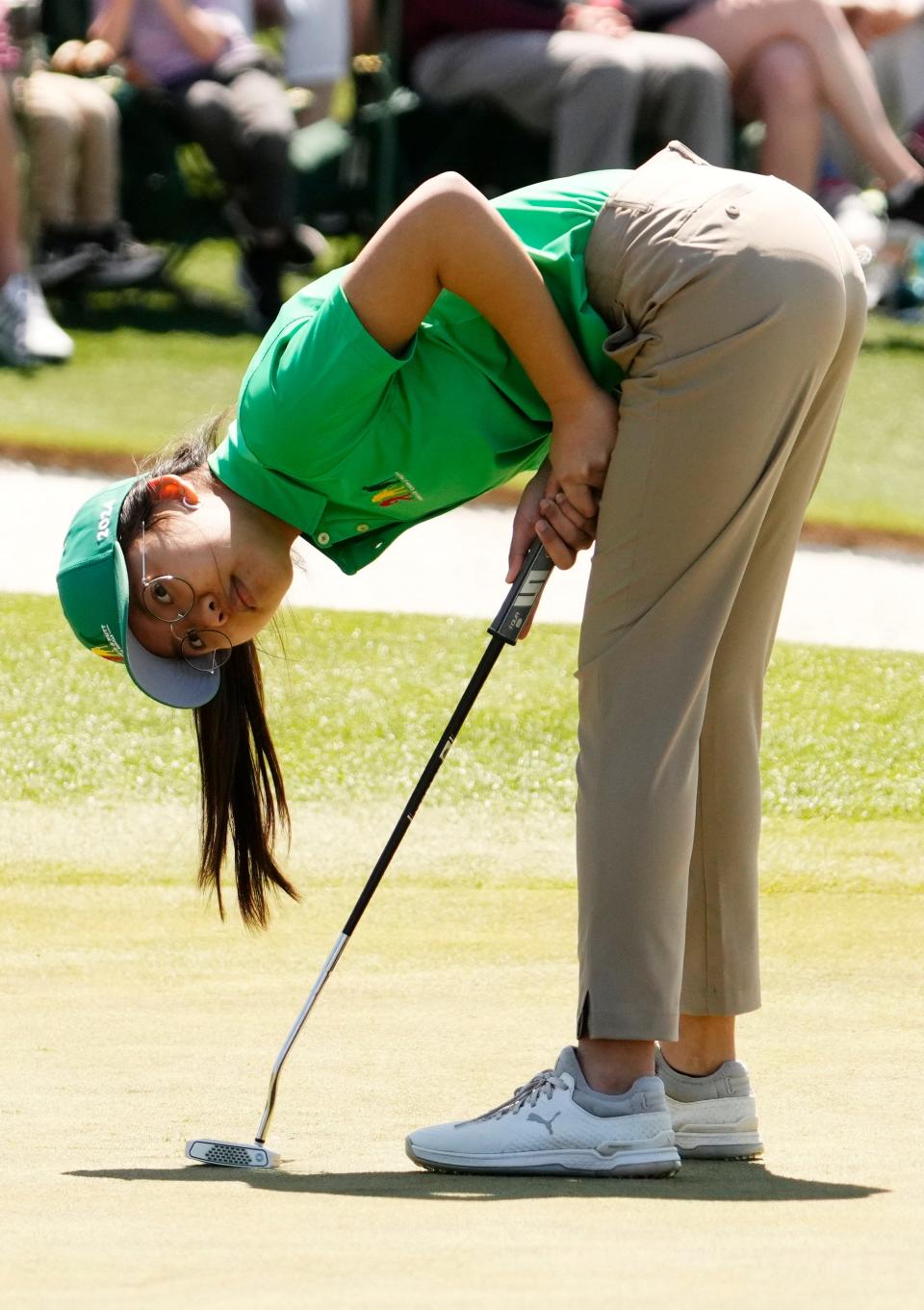 Champa Visetsin from Sudbury, Mass., watches one of her putts during the Drive, Chip & Putt National Finals competition at Augusta National Golf Club.