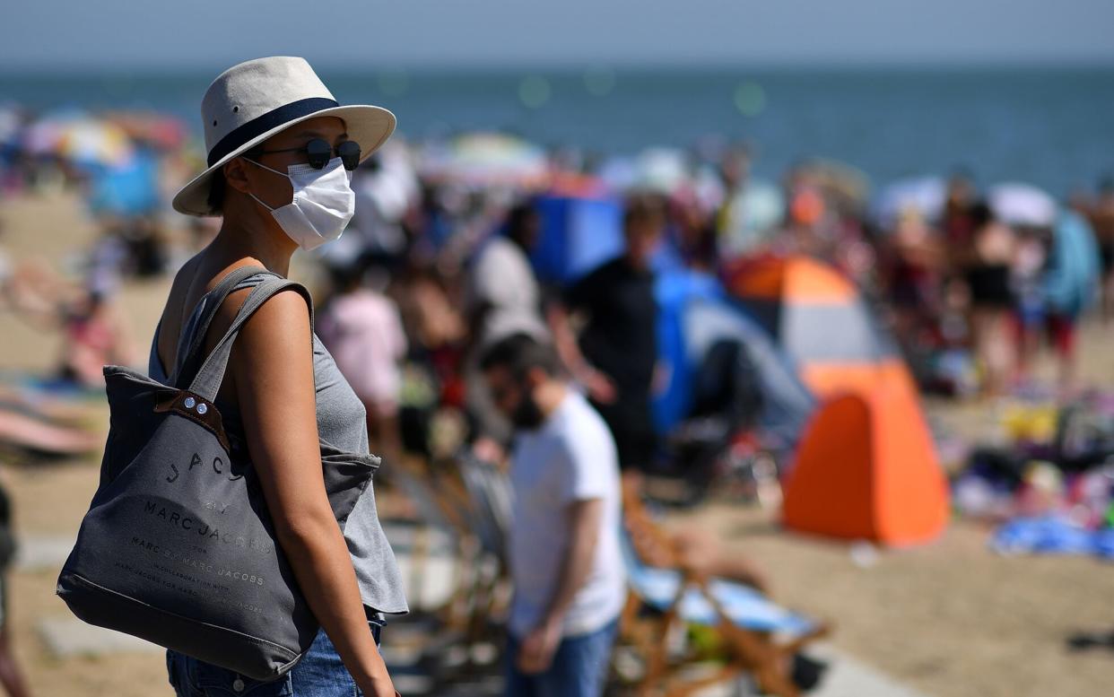 woman wearing face mask - Getty 