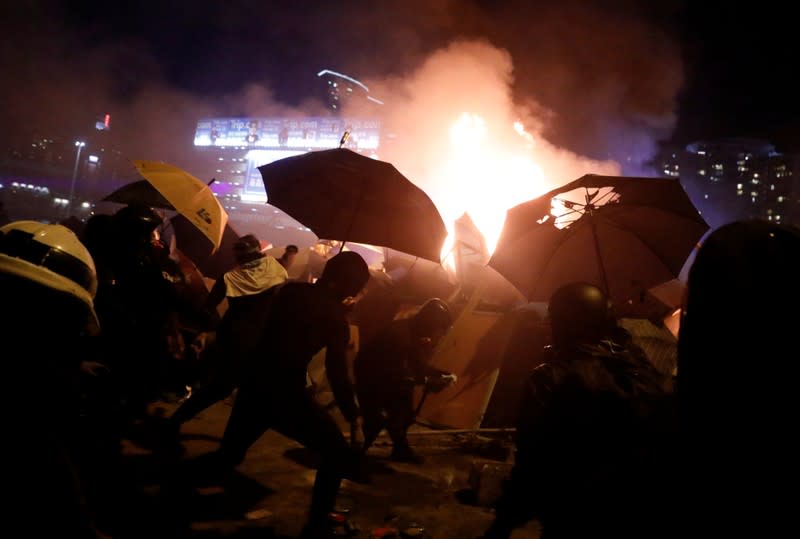 Protesters clash with police outside Hong Kong Polytechnic University (PolyU) in Hong Kong