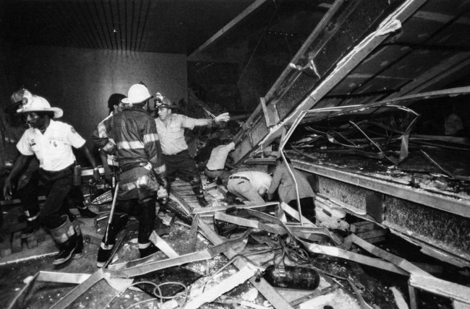 Firefighters urgently worked to free survivors trapped under the collapsed skywalks at the Hyatt Regency in July 1981.