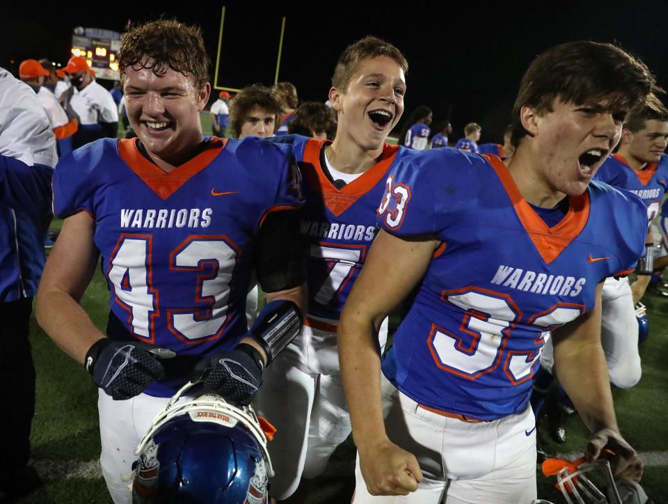 The Whiteland Warriors celebrate after winning Class 5A sectional finals in Whiteland, Ind., Friday, Nov. 6, 2020. Whiteland defeated New Palestine for the title, 48-13. 