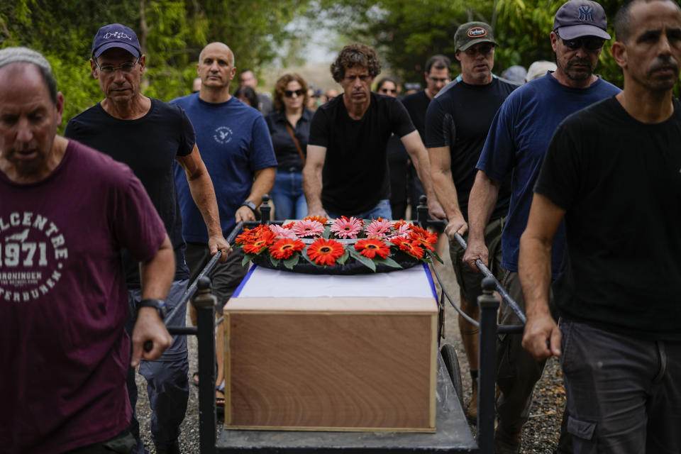 Friends and relatives of Roi Popplewell attend his funeral at kibbutz Yagur near Haifa, north Israel, Friday, Oct. 27, 2023. (AP Photo/Ariel Schalit)