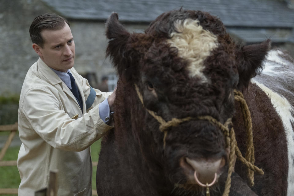 This image released by PBS shows Nicholas Ralph in a scene from "All Creatures Great and Small on MASTERPIECE." The seven-part series based on James Herriot’s adventures as a veterinarian in 1930’s Yorkshire premieres on Sunday. (Matt Squire/ Playground Television and PBS via AP)