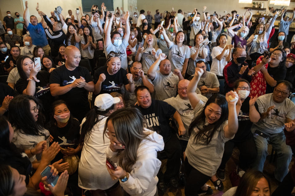 OAKDALE, MN - JULY 29: John Lee (C), father of Sunisa Lee of Team United States, celebrates after she won gold in the Women's All-Around Gymnastics Final on day six of the Tokyo 2020 Olympic Games at a watch party on July 29, 2021 in Oakdale, Minnesota. (Photo by Stephen Maturen/Getty Images)