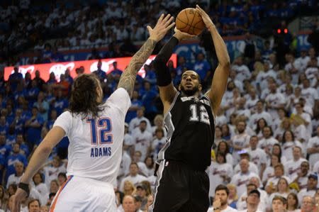 May 6, 2016; Oklahoma City, OK, USA; San Antonio Spurs forward LaMarcus Aldridge (12) shoots the ball over Oklahoma City Thunder center Steven Adams (12) during the fourth quarter in game three of the second round of the NBA Playoffs at Chesapeake Energy Arena. Mandatory Credit: Mark D. Smith-USA TODAY Sports