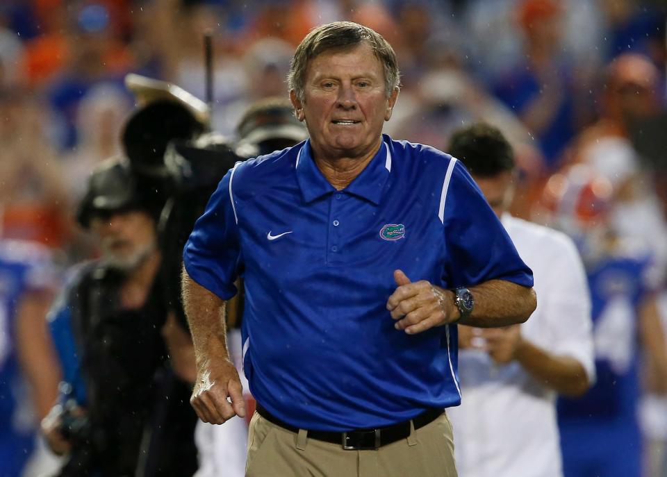 Former Florida coach Steve Spurrier walks on field while being honored before the school's game in 2016 against Massachusetts at Ben Hill Griffin Stadium.