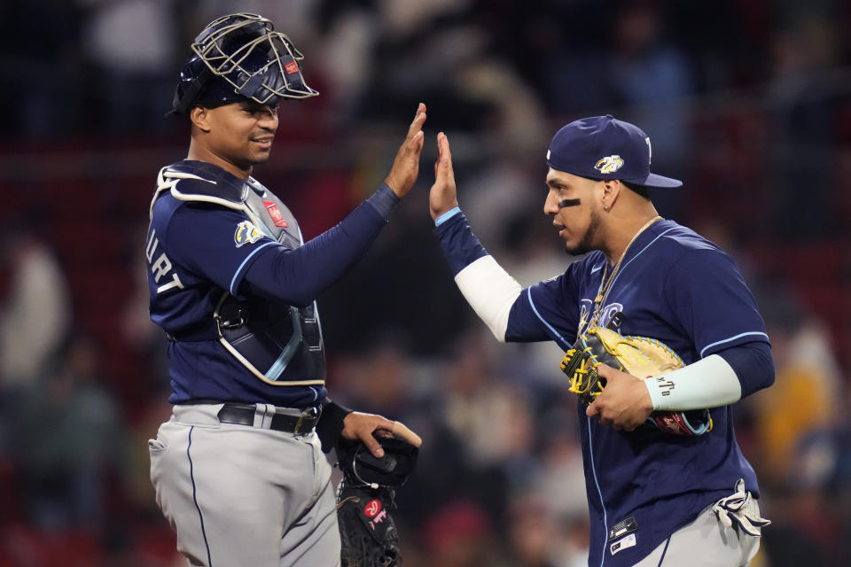 Tampa Bay Rays' Isaac Paredes, right, celebrates with catcher Christian Bethancourt after the team's 5-0 win over the Boston Red Sox in a baseball game at Fenway Park, Wednesday, Sept. 27, 2023, in Boston. (AP Photo/Charles Krupa)