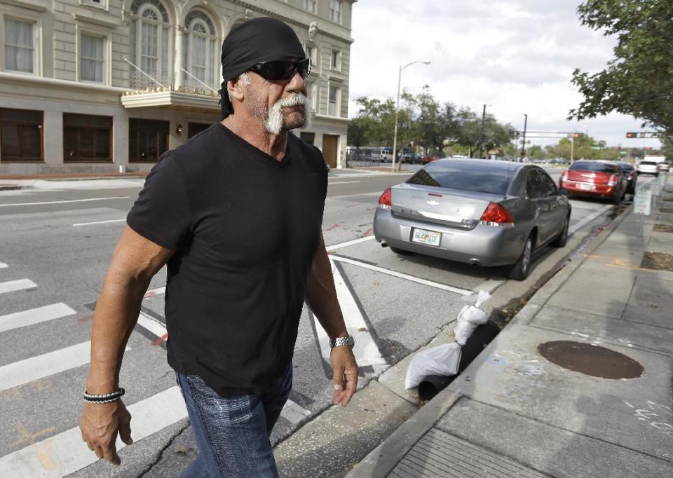 Reality TV star and former pro wrestler Hulk Hogan, whose real name is Terry Bollea, arrives at the United States Courthouse for a news conference Monday, Oct. 15, 2012 Tampa, Fla. Hogan says he was secretly taped six years ago having sex with the ex-wife of DJ Bubba "The Love Sponge" Clem. Portions of the video of Hogan and Heather Clem were posted on the online gossip site Gawker. (AP Photo/Chris O'Meara)