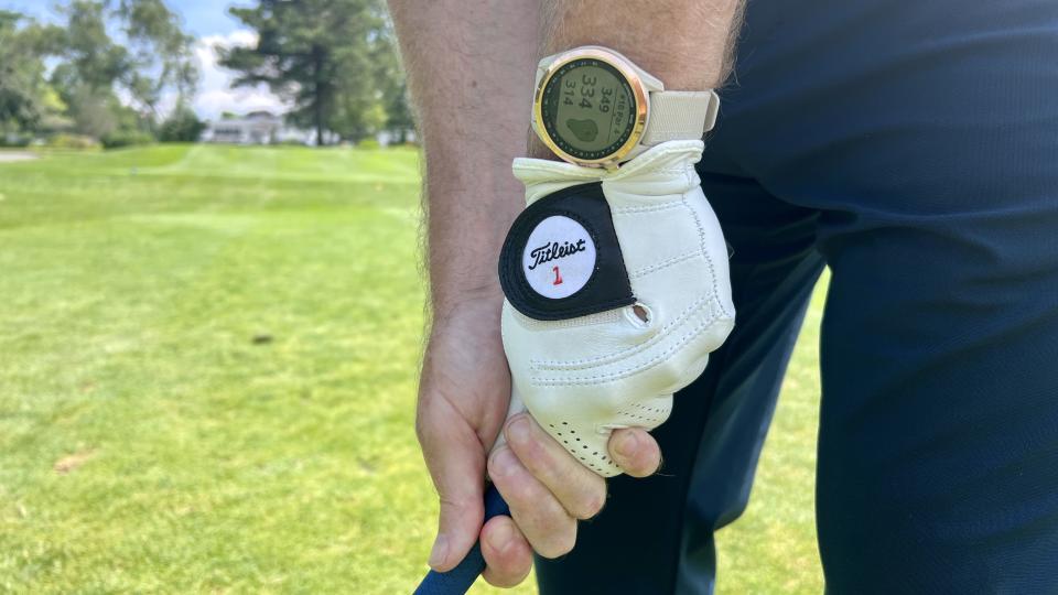 a photo of the Garmin Approach S42 with a golf glove