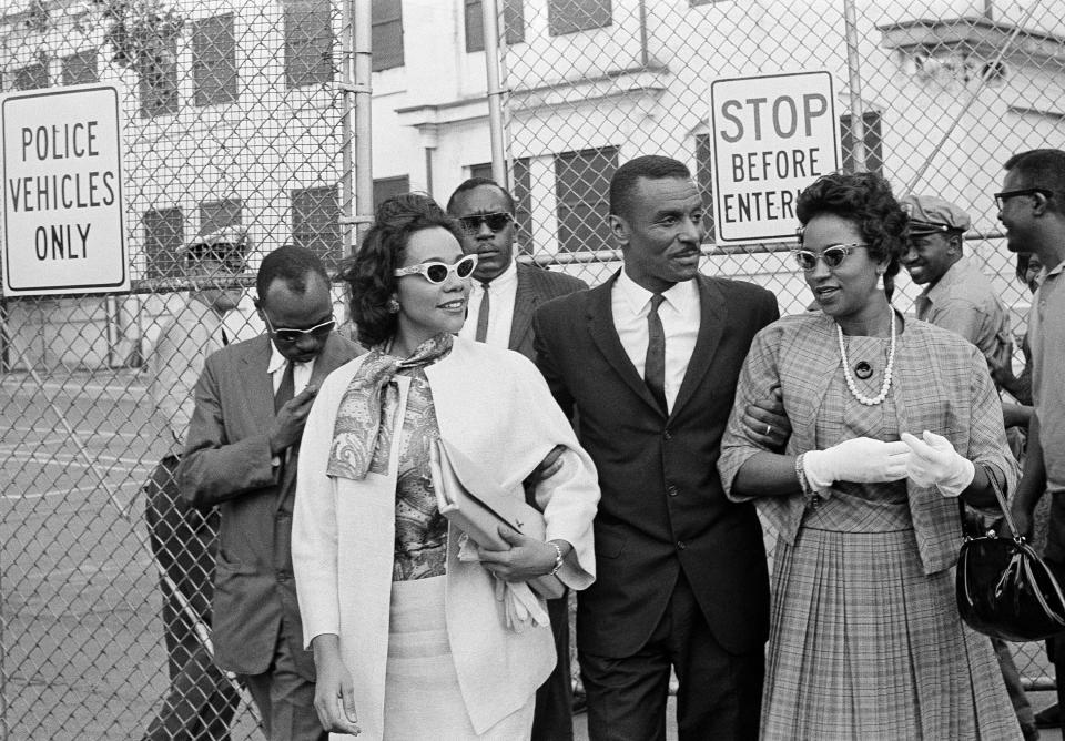 FILE - In this April 18, 1963 file photo, Coretta Scott King Jr., left, the Rev. Fred L. Shuttlesworth, center, and Mrs. Juanita Abernathy, leave Birmingham jail after visiting Rev. Martin Luther King, Jr. and Rev. Dr. Ralph Abernathy in Birmingham, Ala. Juanita Abernathy, who wrote the business plan for the 1955 Montgomery Bus Boycott and took other influential steps in helping to build the American civil rights movement, has died. She was 88. Family spokesman James Peterson confirmed Abernathy died Thursday, Sept. 12, 2019 at Piedmont Hospital in Atlanta following complications from a stroke.(AP Photo/File)