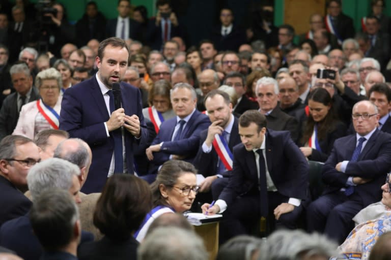 Participants at the townhall-style meeting with French President Emmanuel Macron and junior territorial communities minister Sebastien Lecornu (standing, left) said they felt they were living in a "two-speed France"