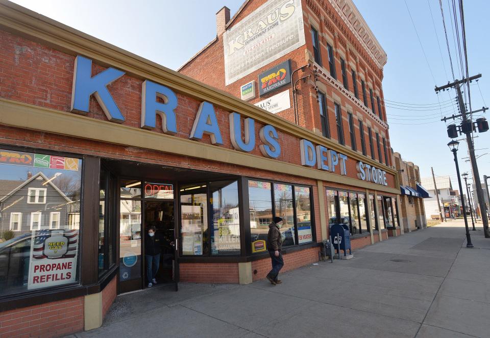 A customer leaves Kraus Department Store on March 19.