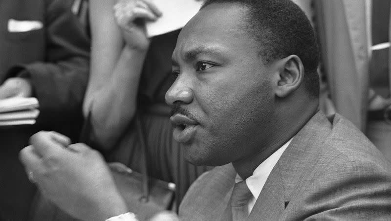 The Rev. Martin Luther King Jr. makes an announcement in Birmingham, Alabama, on May 9, 1963. Widespread racial harassment and discrimination are still prevalent today.