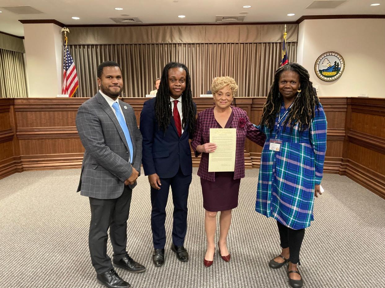 Buncombe County Board of Commissioners present Oralene Simmons, chair of the The Martin Luther King, Jr. Association of Asheville and Buncombe County, with a proclamation recognizing Black Legacy Month. From left to right: Commissioner Martin Moore, Equity and Inclusion Workgroup member Mylon Patton, Oralene and workgroup member Joy Wilson.