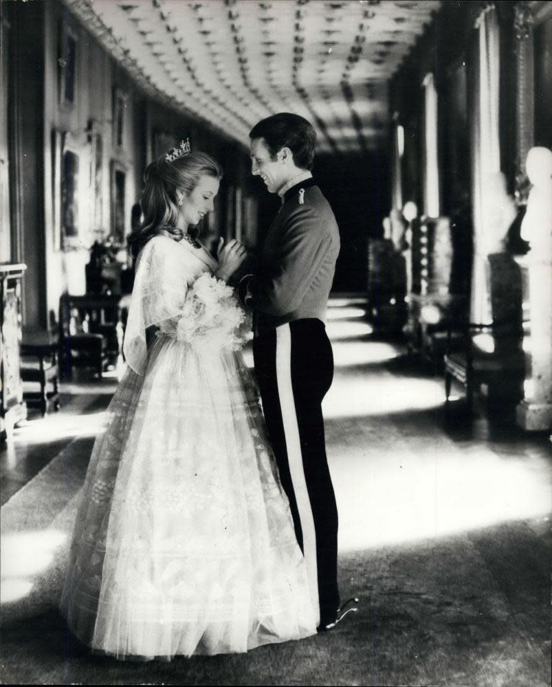 Princess Anne wearing her Zandra Rhodes wedding dress with Captain Mark Phillips in November 1973.