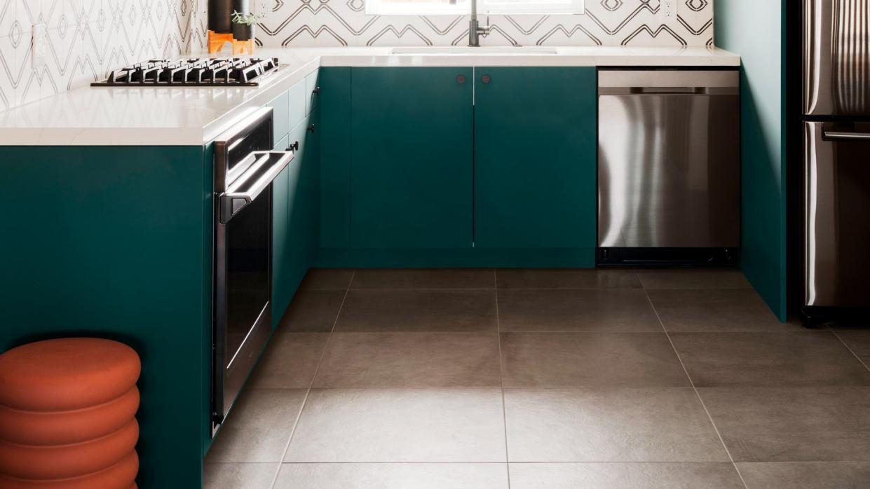 open kitchen shelving ideas, patterned backsplash floating wood shelves, terra cotta colored upper walls, cabinets painted in dunn edwards's ecological green