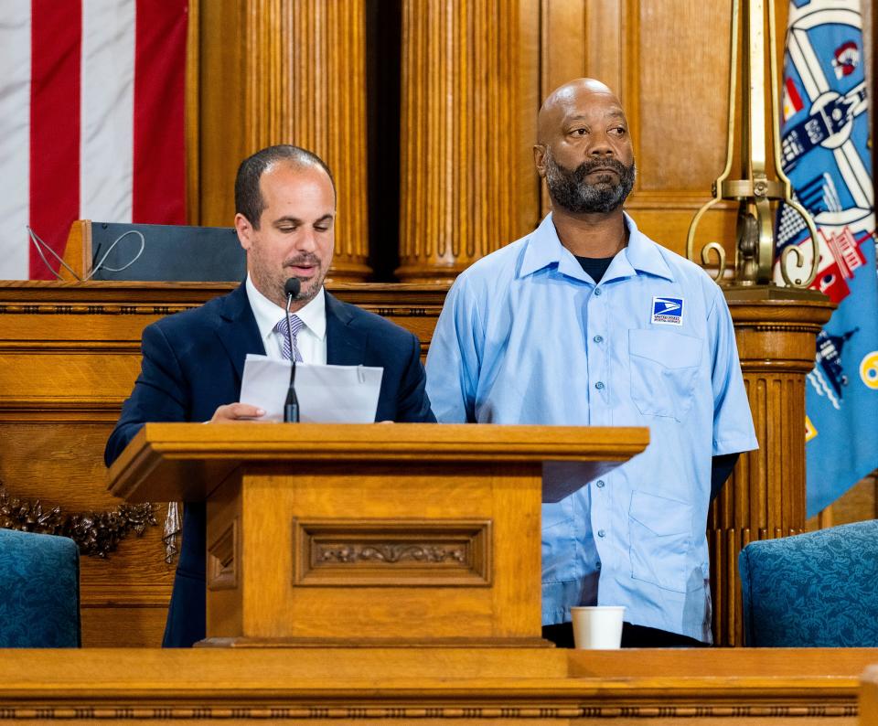 (Left) 3rd District Alderman Jonathan Brostoff honors (right) Michael "Mailman Mike" Boothe in the Common Council chambers on Tuesday September 19, 2023 Milwaukee City Hall in Milwaukee, Wis.