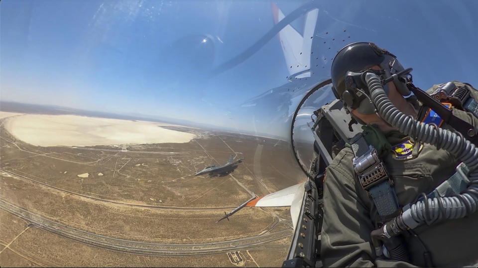 This image from remote video released by the U.S. Air Force shows Air Force Secretary Frank Kendall during his experimental flight inside the cockpit of a X-62A VISTA aircraft autonomous warplane above Edwards Air Base, Calif, on Thursday, May 2, 2024. The AI-controlled flight is serving as a public statement of confidence in the future role of AI in air combat. (United States Air Force Photo via AP)