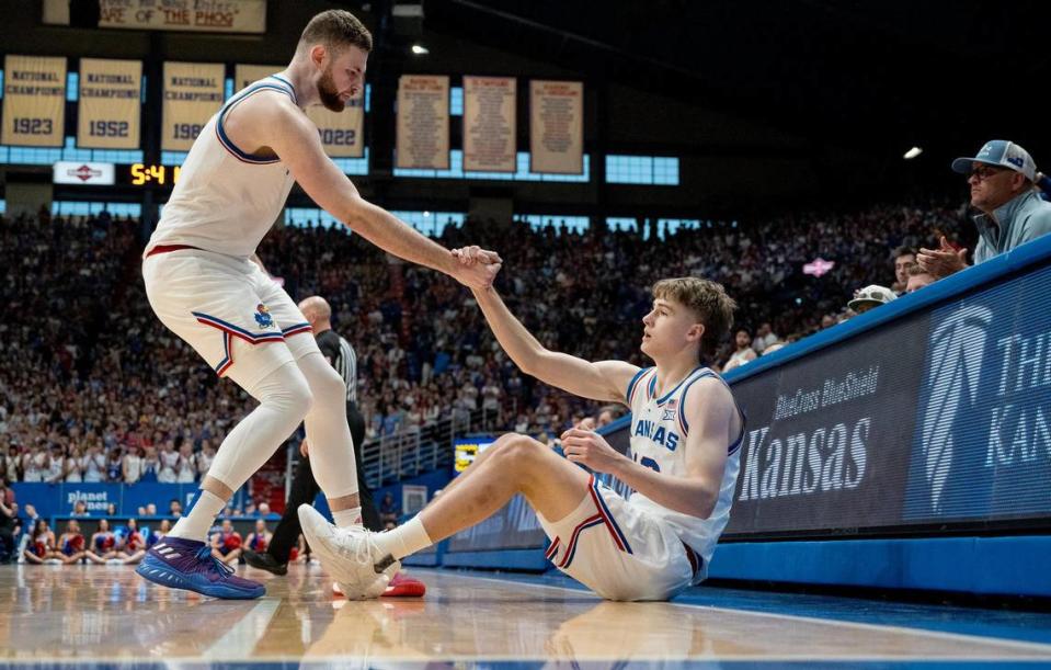 Kansas Jayhawks guard Johnny Furphy (10) is picked up by a teammate, center Hunter Dickinson, during an NCAA college basketball game against the Texas Longhorns on Saturday, Feb. 24, 2024, in Lawrence. Nick Wagner/nwagner@kcstar.com