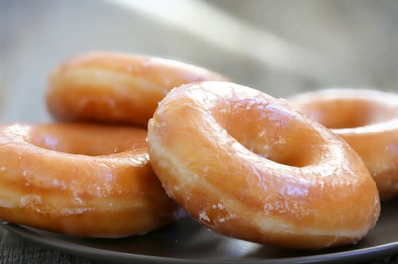 A plate of glazed donuts.