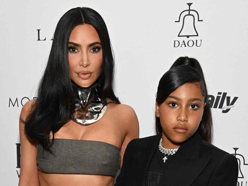 <p>Michael Kovac/Getty</p> Kim Kardashian and North West