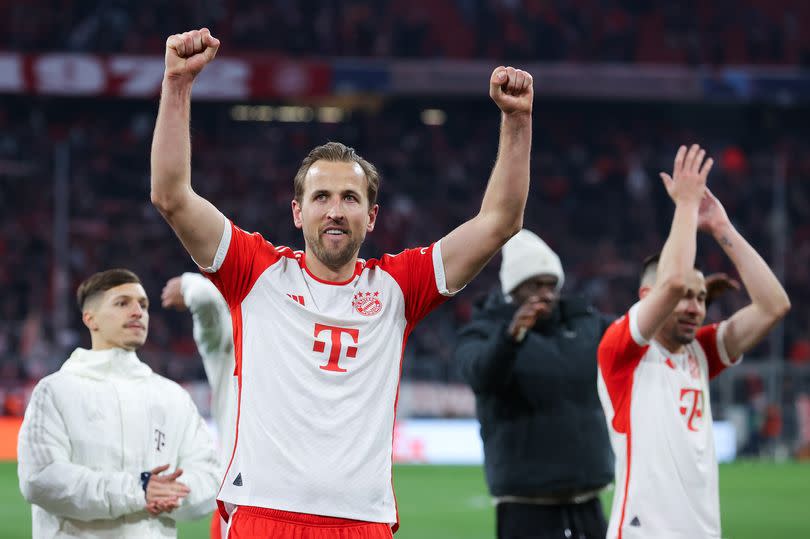 Harry Kane celebrates beating Arsenal