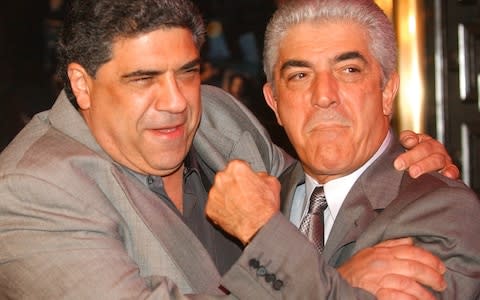 Actors Vincent Pastore, left, and Frank Vincent rough around for photographers at the fifth season premiere of the HBO series "The Sopranos,"  - Credit: AP