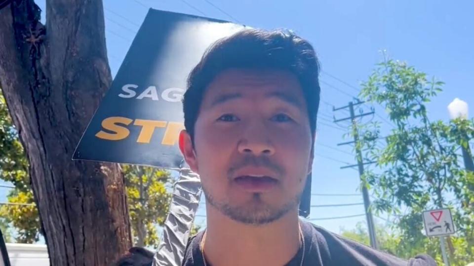 Simu Liu picketing at Amazon Studios, August 2