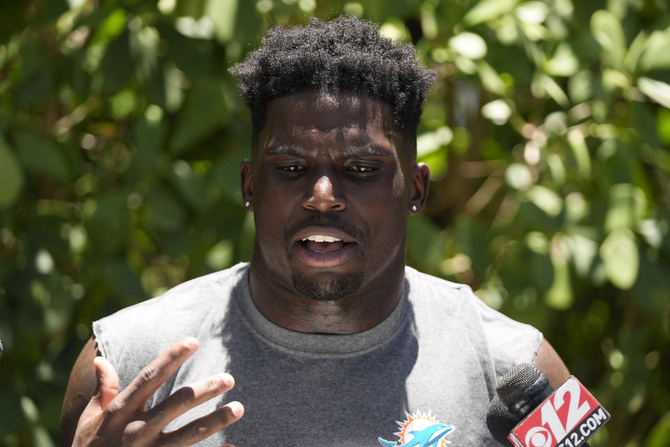 Miami Dolphins wide receiver Tyreek Hill speaks to members of the media after an NFL football practice at the team's practice facility, Tuesday, June 4, 2024, in Miami Gardens, Fla. (AP Photo/Wilfredo Lee)