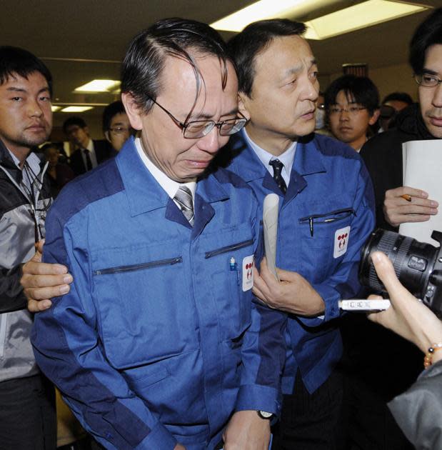 TEPCO boss Akio Komori cries in front of the media at Fukushima. (AP photo)