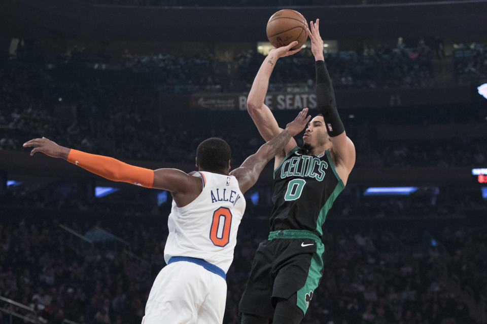 New York Knicks guard Kadeem Allen, left, guards Boston Celtics forward Jayson Tatum during the second half of an NBA basketball game, Friday, Feb. 1, 2019, at Madison Square Garden in New York. The Celtics won 113-99. (AP Photo/Mary Altaffer)