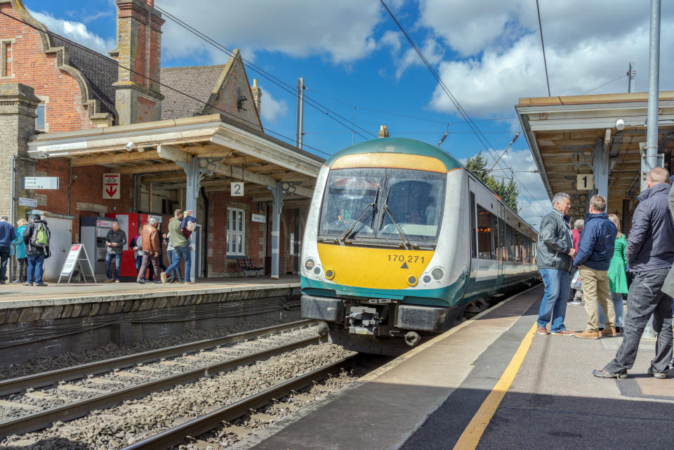 Stowmarket, UK. 17th April 2017. People are on platforms at Bury St Edmunds awaiting their onward departures. A Class 170 turbostar DMU train is about to depart for Ipswich.