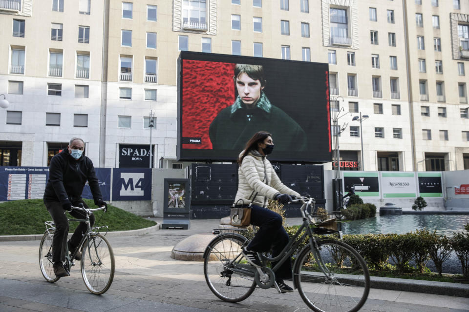 A giant screen streams a Prada fashion live show during the Milan's fashion week in Milan, Italy, Sunday, Jan. 17, 2021. (AP Photo/Luca Bruno)