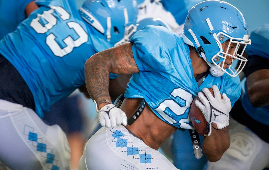 North Carolina running back Omarion Hampton (28) carries the ball during the Tar Heels’ practice on Tuesday, August 8, 2023 in Chapel Hill, N.C.
