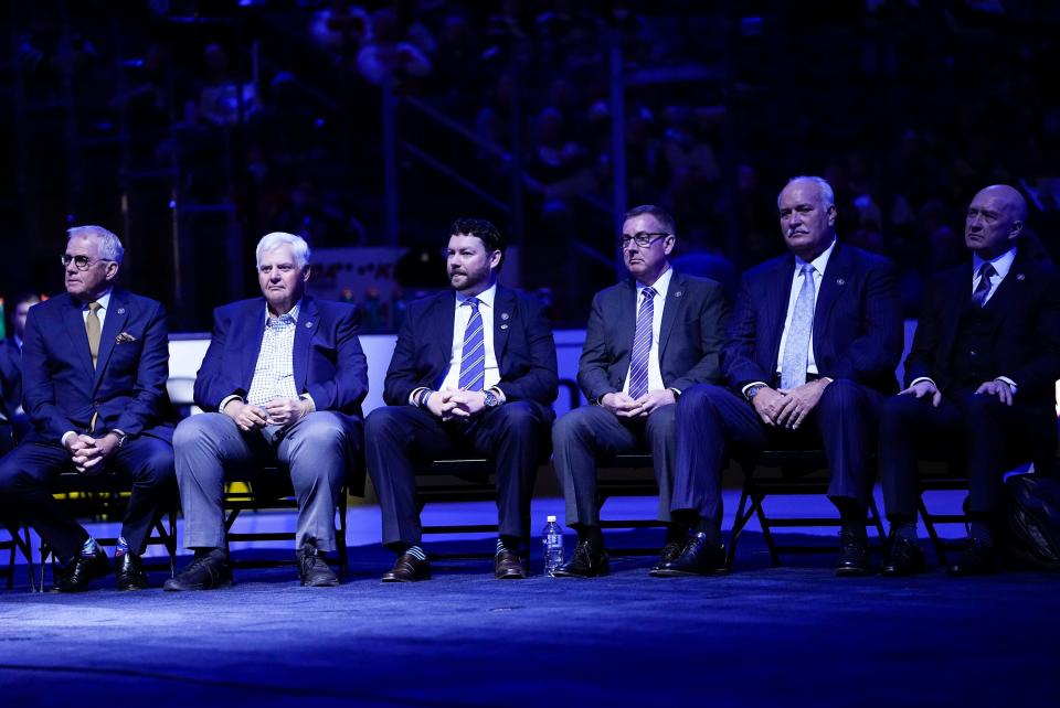 From left, Doug Maclean, Ken Hitchcock, John H. McConnell II, Michael Priest, John Davidson and Jarmo Kekalainen watch during the No. 61 jersey retirement ceremony for Rick Nash prior to the NHL hockey game against the Boston Bruins at Nationwide Arena in Columbus on March 5, 2022. 