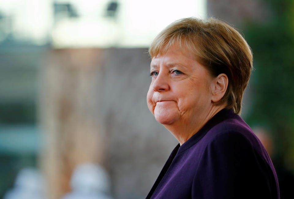 German Chancellor Angela Merkel waits for Singapore's President Halimah Yacob at the Chancellery in Berlin, Germany, December 10, 2019. REUTERS/Hannibal Hanschke