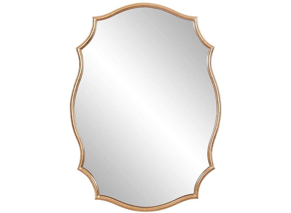 Add some allure to your walls with this stunning gold mirror. 