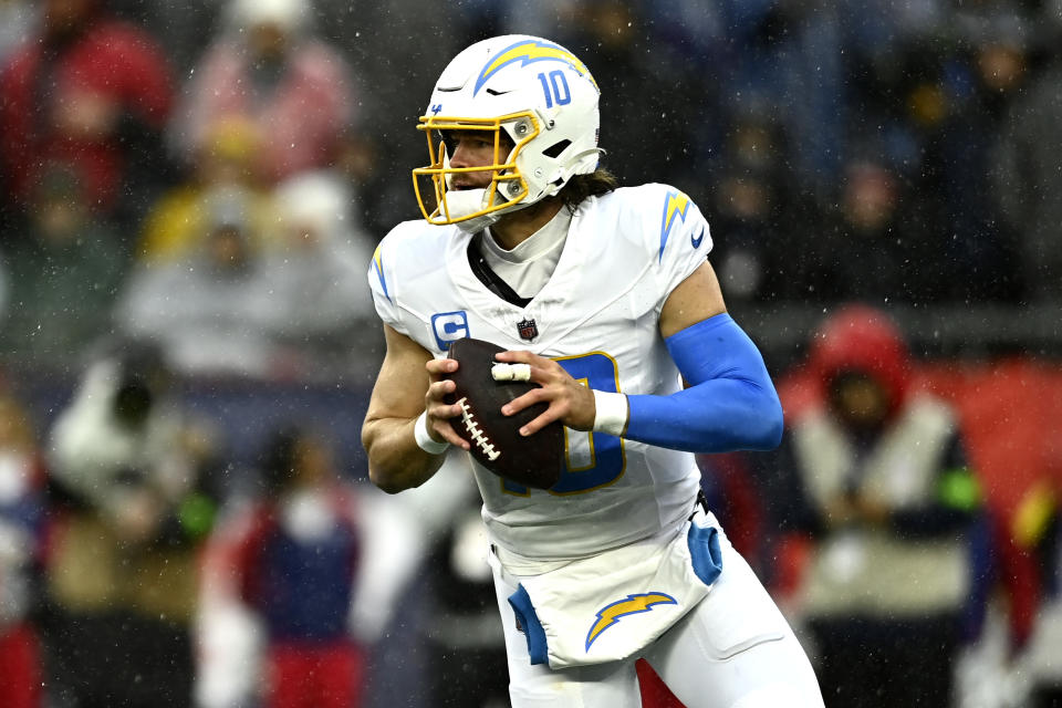 FOXBOROUGH, MASSACHUSETTS - DECEMBER 03: Justin Herbert #10 of the Los Angeles Chargers throws during the game against the New England Patriots at Gillette Stadium on December 03, 2023 in Foxborough, Massachusetts. (Photo by Billie Weiss/Getty Images)