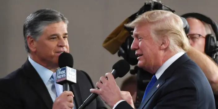 Fox News Channel and radio talk show host Sean Hannity (L) interviews U.S. President Donald Trump before a campaign rally at the Las Vegas Convention Center on September 20, 2018 in Las Vegas, Nevada.