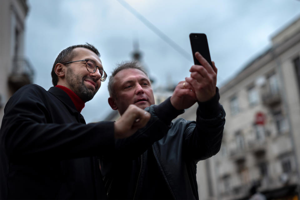 A supporter of Serhiy Leshchenko, takes a selfie on the street in Kyiv, Ukraine on October 29, 2019. (Photo: Agron Dragaj for Yahoo News) 