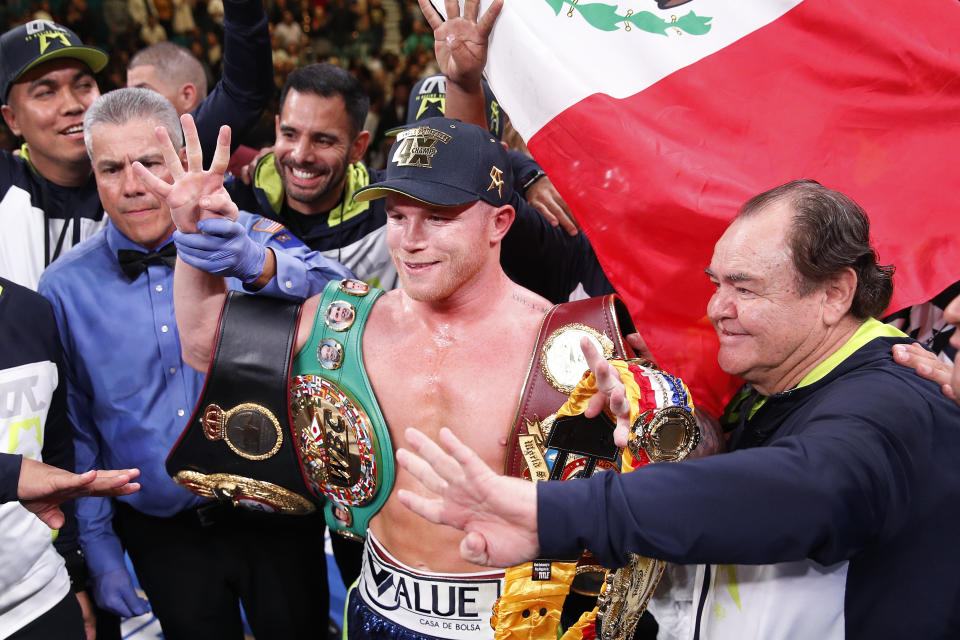 Canelo Alvarez poses for photos after defeating Sergey Kovalev in a light heavyweight WBO title bout, Saturday, Nov. 2, 2019, in Las Vegas (AP Photo/John Locher)