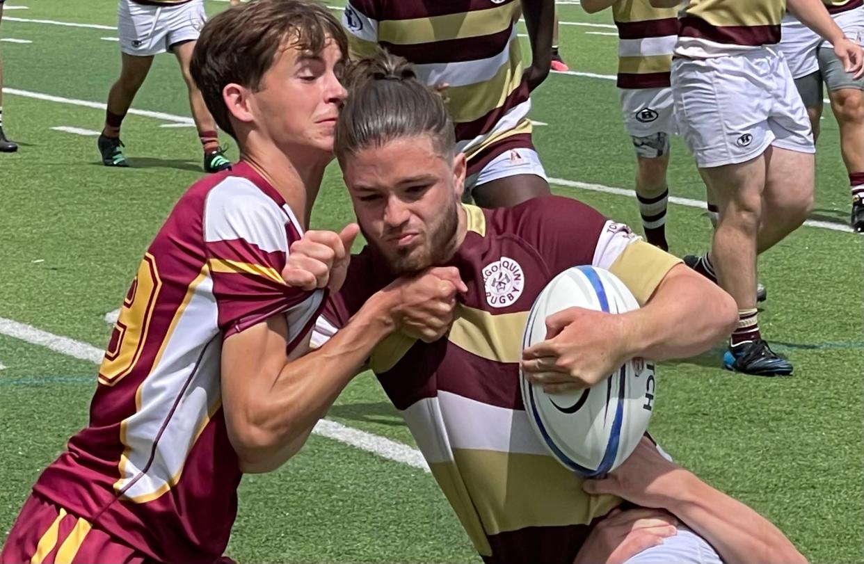 Nick Southey of Algonquin, right, is wrapped up by Weymouth’s Seamus Foley during Sunday’s Division 2 rugby state championship in Milton.