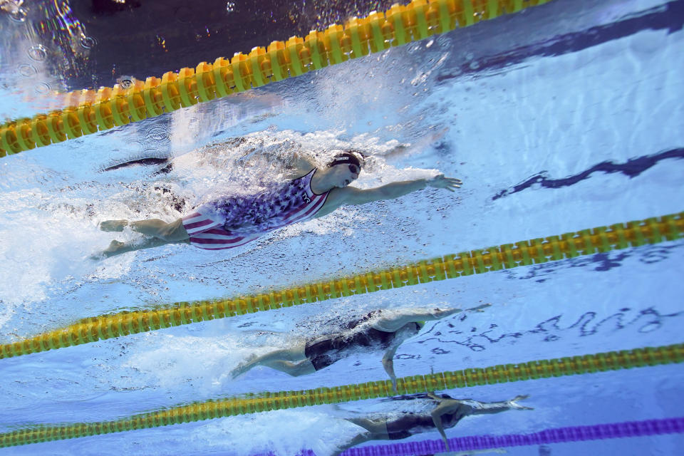 United State's Katy Ledecky, top, swims in a 200-meter freestyle semifinal at the 2020 Summer Olympics, Tuesday, July 27, 2021, in Tokyo. (AP Photo/David J. Phillip)